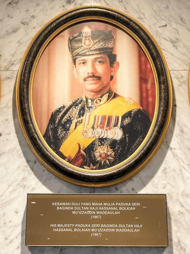 Photo of a sultan, dressed in formal wear with medals and a decorative hat, in an oval frame.