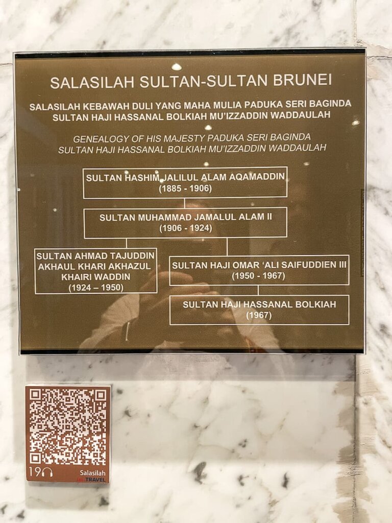 A gold plaque on a marble background with words in white