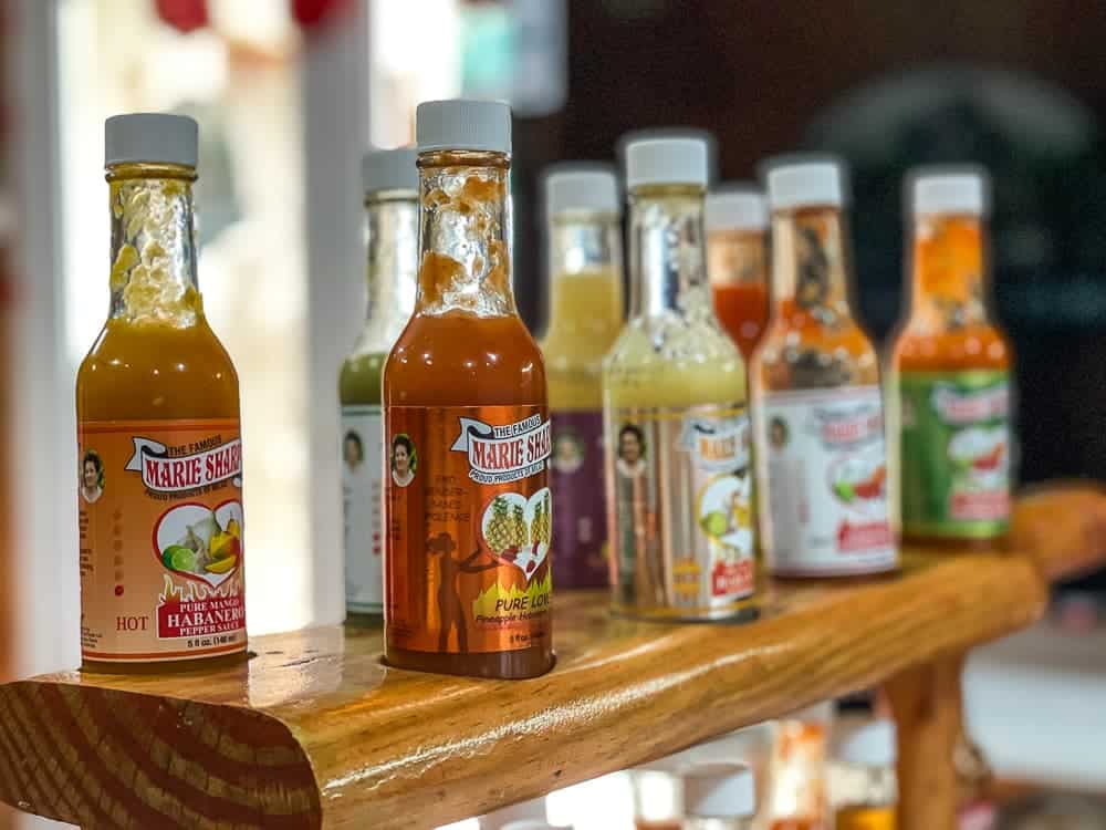 a wooden rack of hot sauces